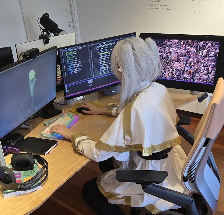 On X @isainstars 'debugging code before going to an anime convention'